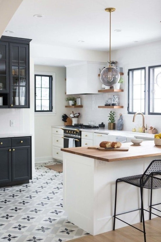 printed mosaic tiles in the kitchen and light-colored laminate with a sharp transition