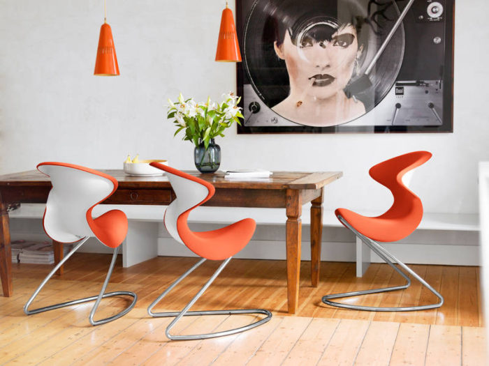 This dining setting is fun and the splash of orange really adds a lot to the room setting, corresponding hanging lights look awesome with Oyo chairs