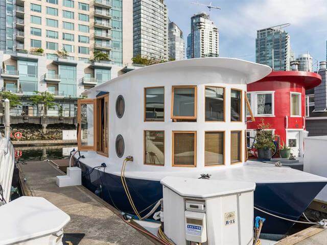 This floating house is styled like a real boat both inside and outside