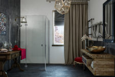 02 Dark tiles, a minimalist shower, a rustic reclaimed wood countertop and a vintage rustic table look cool together