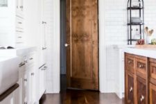 02 white kitchen with a stained hardwood floor and wood island and door
