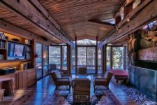 03 The interiors are rustic, the use of warm woods and stone makes these rooms very cozy and inviting