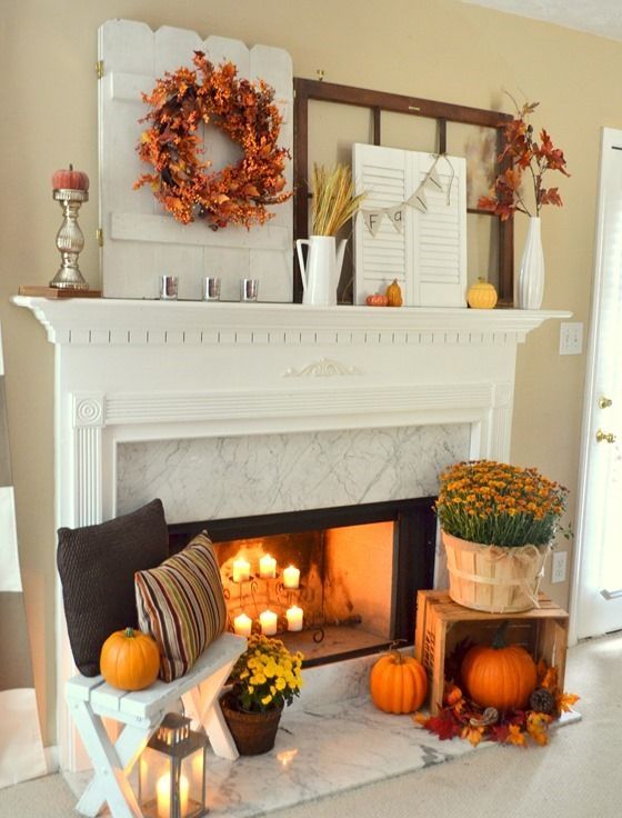 fall leaf wreath, wheat in a coffee pot, an old barn door piece and an old shutter