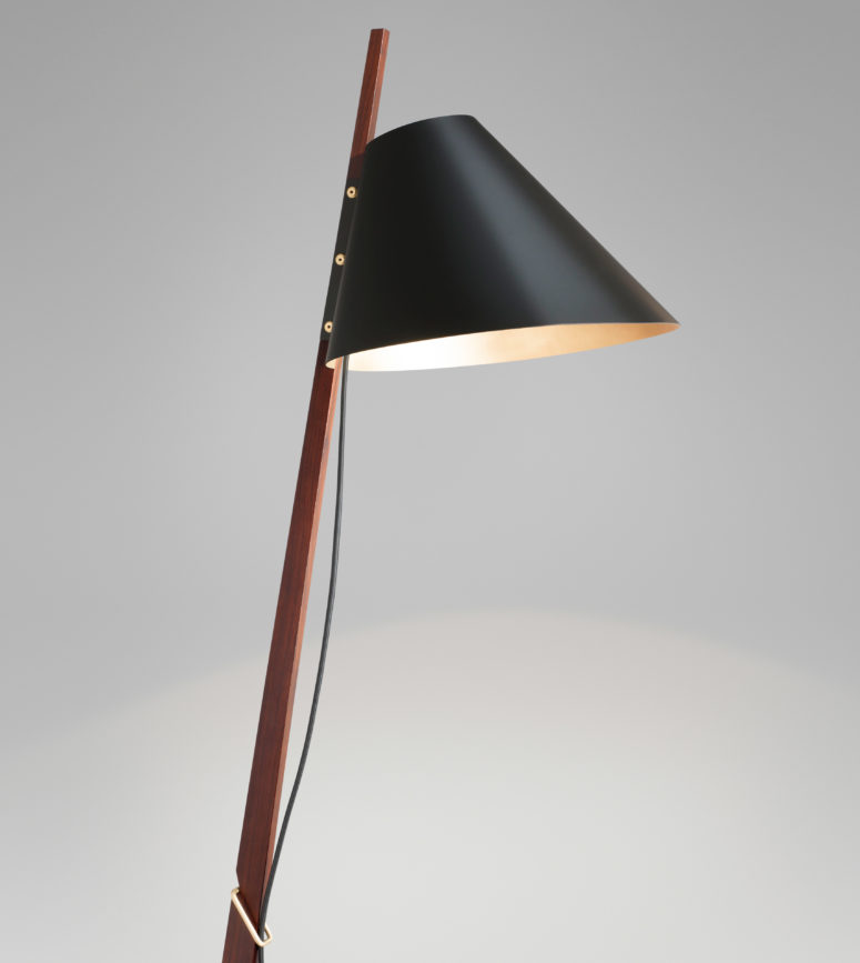 The lampshade features a duotone finish, matte black exterior with satin brass interior, creating an ambient feel