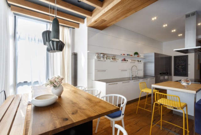 The wood is extensively used to make the apartment cozier and warmer