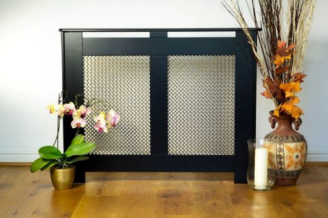 dark radiator cover and a plant stand in one