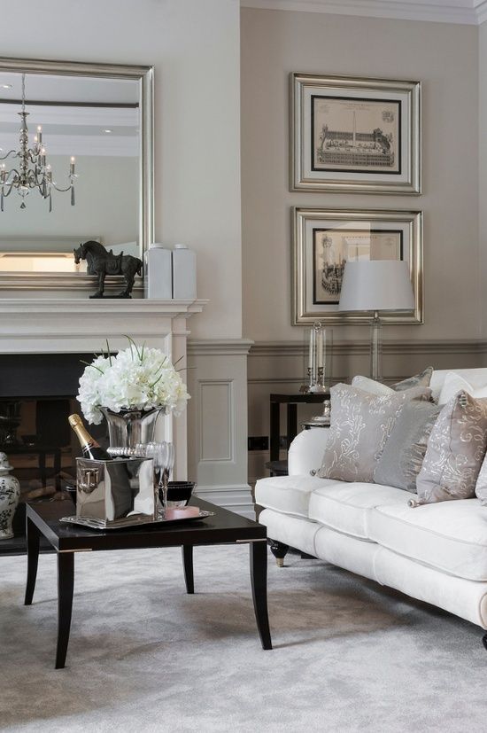 elegant neutral-colored living room with grey wainscoting