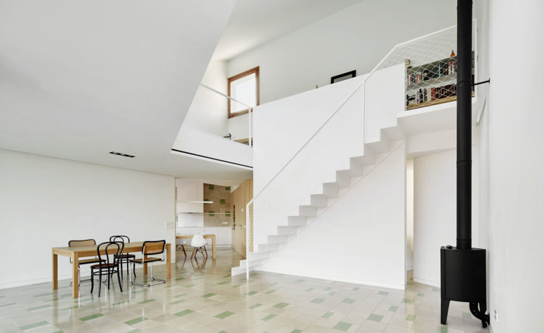 The clean and refined interiors showcase a simple, yet rich material palette