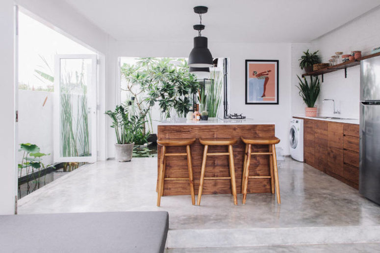 The open plan kitchen with a sunken lounge faces a beautiful Mexican garden