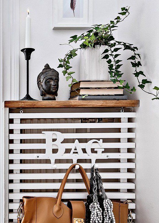 hallway radiator cover as a shelf and bag holder