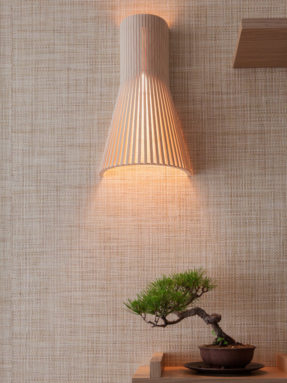 Even this lamp is made of wood and attached to the wall, it's so unusual