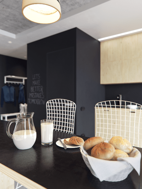 The chairs have an industrial feel with their metal grid backs