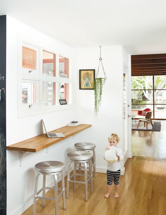 home office nook with a wall-mounted desk