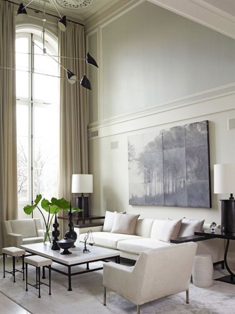 modern refined space with tall wainscoting and an artwork on it