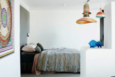 07 The bedroom space has an ethnic flavor with these textiles and woven lamps