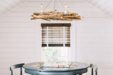 07 The dining zone is accentuated with a whimsy chandelier made of wood, rope and bulbs