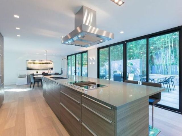 whitewashed hardwood flooring for a modern kitchen with Corian countertops