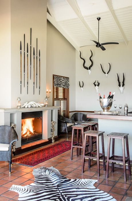 Buttermilk walls, spears and a faux zebra rug create an ambience here