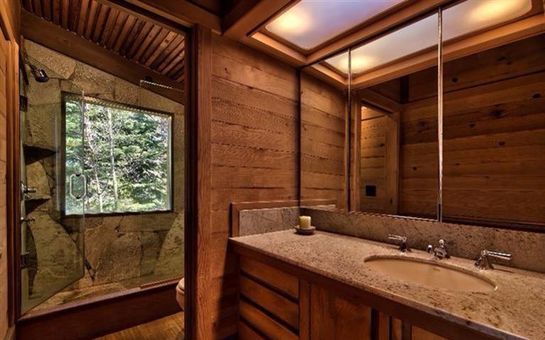 stone bathroom design Natural stone and marble was used in the bathroom to give it a luxurious look and make the surfaces more durable