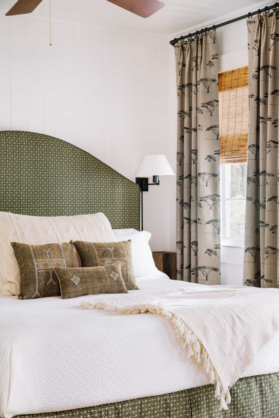 The master bedroom is decorated in calm and muted colors