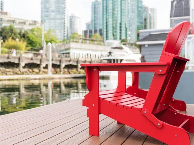 There is a couple of red chairs on the pier to sit and enjoy the sunsets