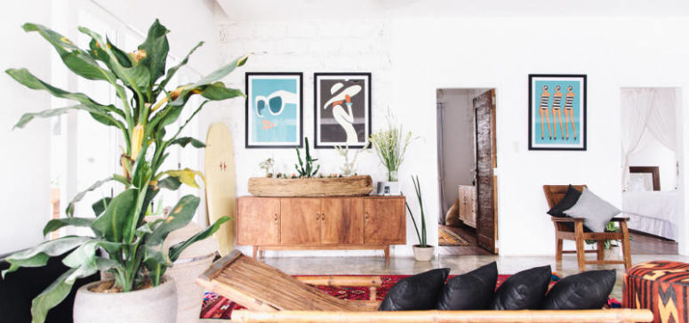 The use of natural wood furniture and accessories and bold wall art makes the home trendier