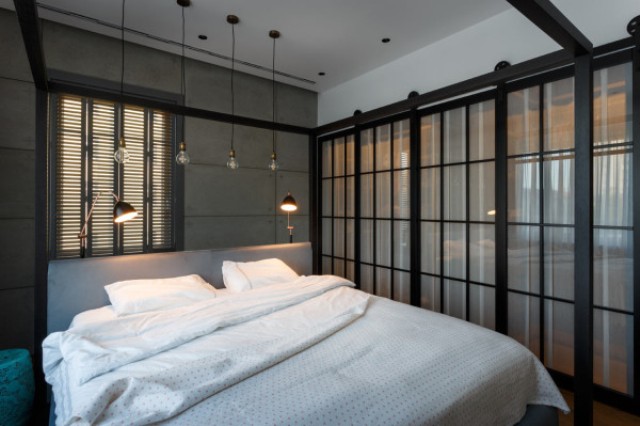 Behind the sliding glass doors there are two closets hidden
