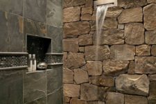 10 stone wall in the shower and a water shower head make bathing experience spa-like