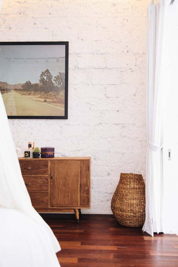 Warm woods and woven items add to the coziness of the room