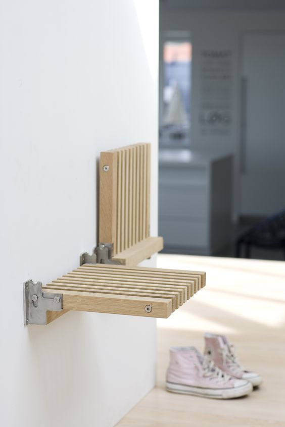 foldable wall-mounted stool is a great space saving solution for a tiny entryway