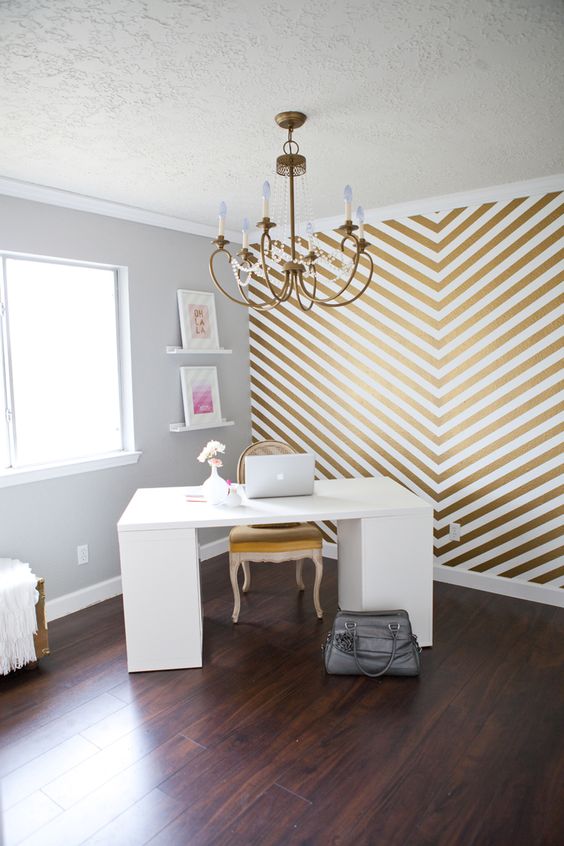 a gold chevron wall glams up the home office