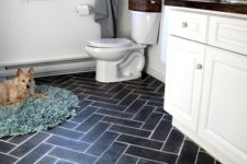 12 dark herringbone floors using vinyl tiles that imitate porcelain ones