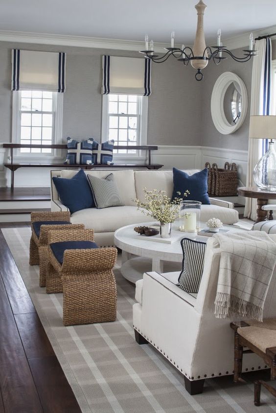 white wainscoting works well with grey walls in this coastal living room