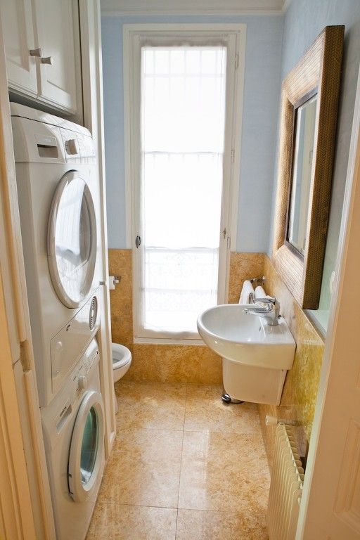 small bathroom and laundry combo covered with cork