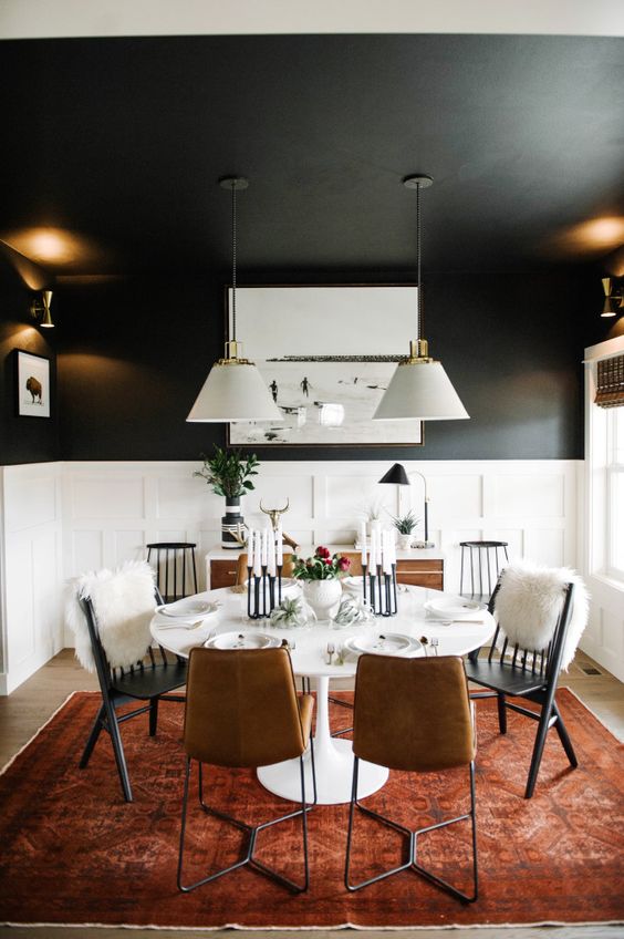 black dining room walls with white wainscoting