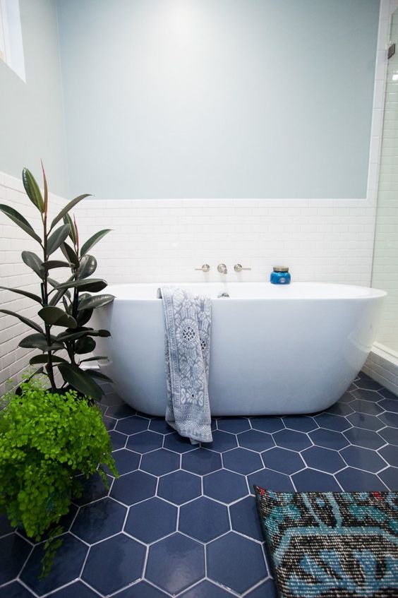 blue hexagon tiles and greenery make up the whole bathroom decor
