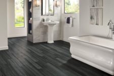 14 dark grey and black vinyl plank flooring, which is water resistant