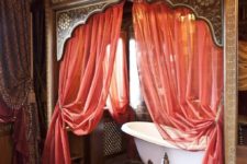 14 pink curtains, a purple bedspread, colorful tiles for creating an ambience