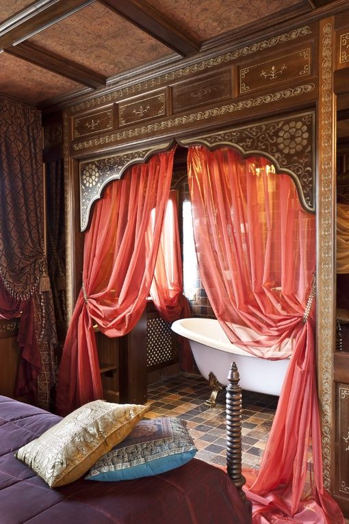 pink curtains, a purple bedspread, colorful tiles for creating an ambience