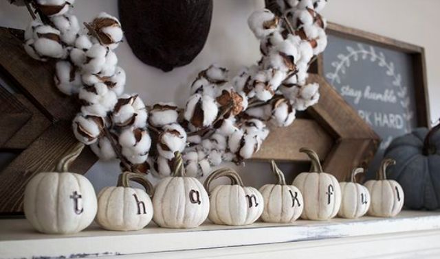 pumpkins with letters and a cotton wreath