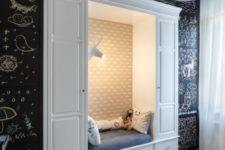 15 A cozy reading nook for the kid is inserted into a chalkboard wall, which hides cabinets