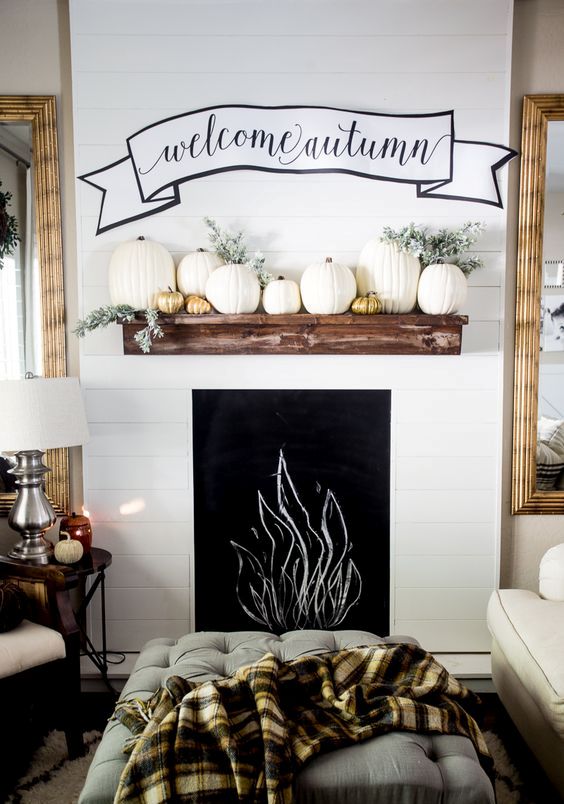 faux mantel with pumpkins and a fabric wall decoration faux mantel with pumpkins and a fabric wall decoration
