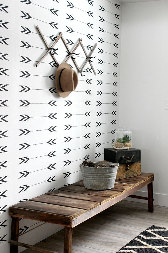 monochrome wallpaper to accentuate the entryway area in an open space