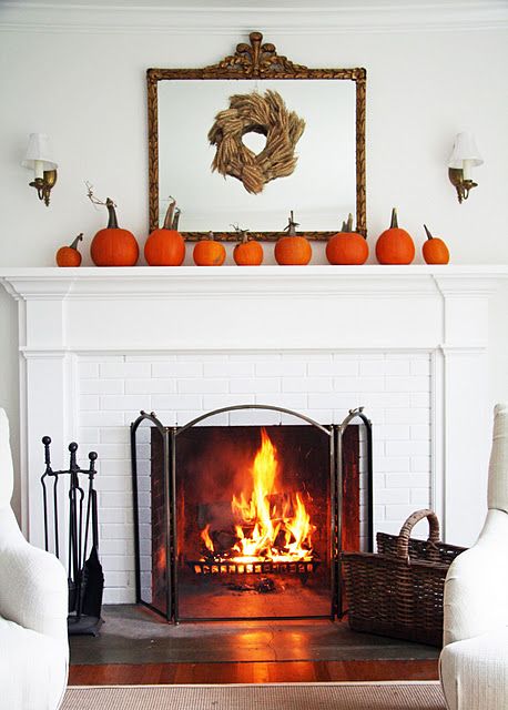 natural orange pumpkins with wheat wreath and a framed mirror