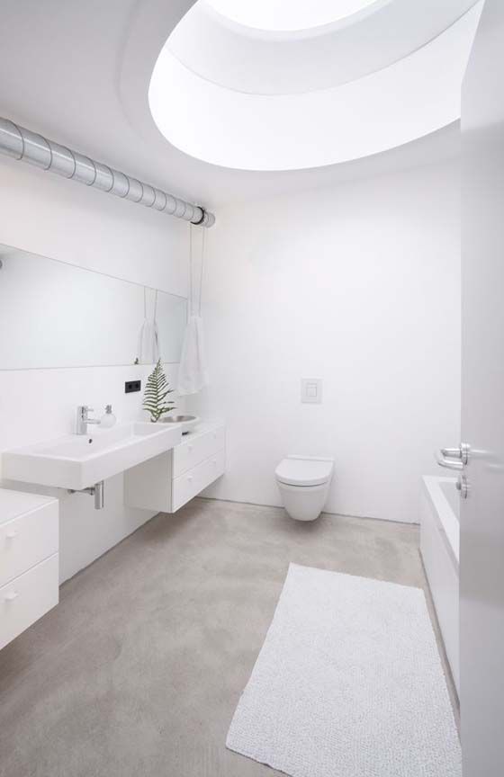 natural concrete floor for a clean all-white bathroom