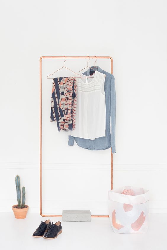 simple copper and concrete rack that can work as a space divider