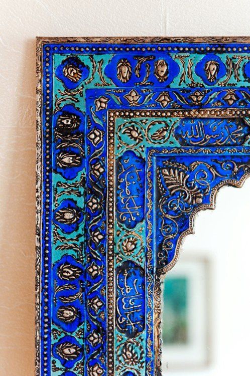 carved and painted mirror frame