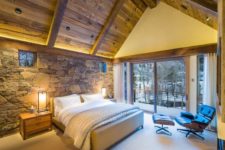 21 natural stone headboard wall and a wooden ceiling