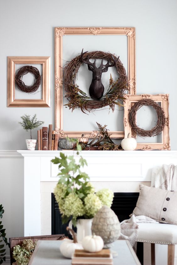 framed wreaths framed twig wreaths, a faux deer head, faux pumpkins