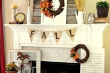 23 burlap bunting, wheat, fall wreath and a small pumpkin on a stand
